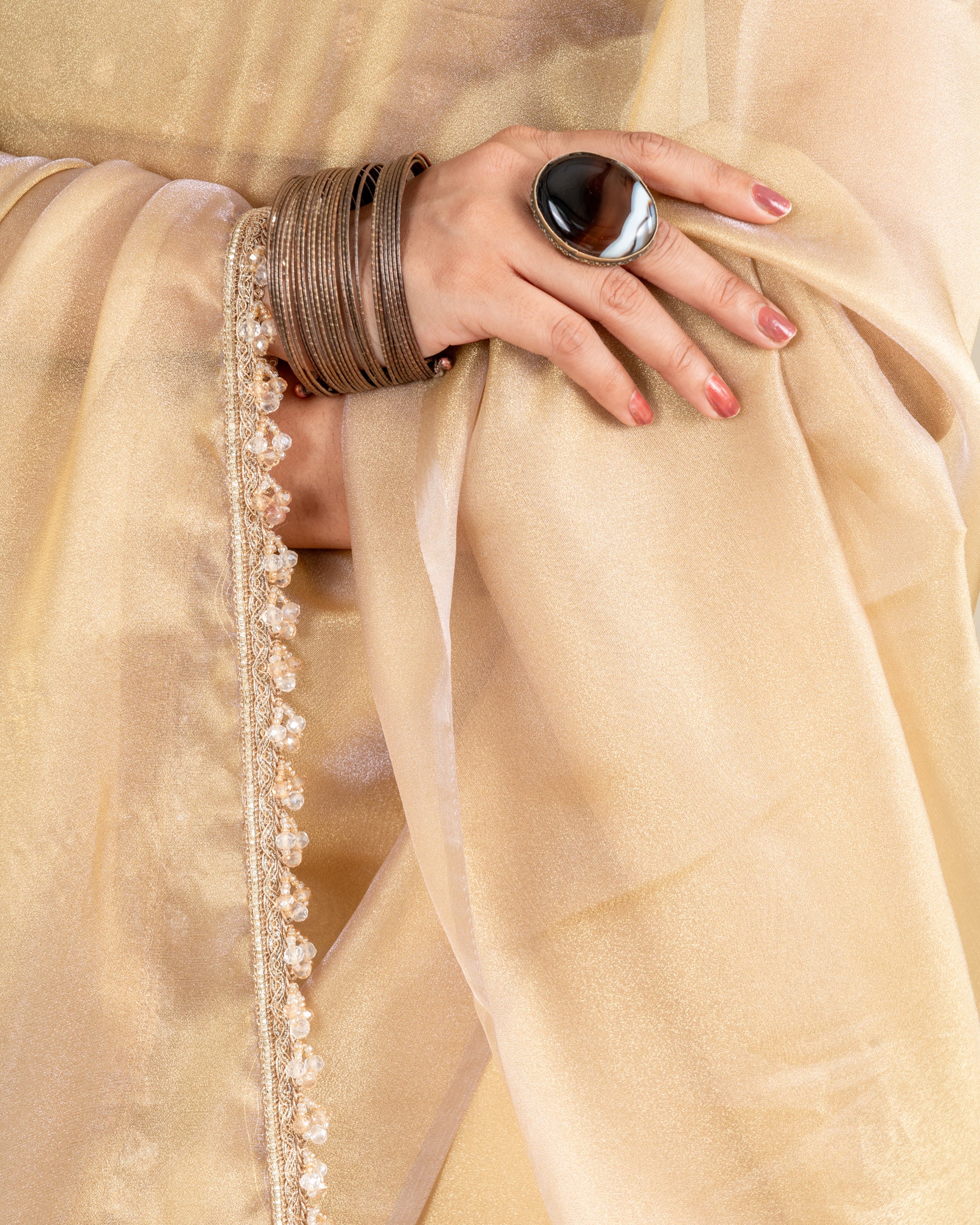 Chikoo Organza Saree with Handcrafted Crystal Beads Lace & Golden Buti Blouse Piece