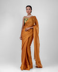 Amber Gold Iconic Chiffon Saree with Handcrafted Mirror Tassels and Matching Blouse Piece