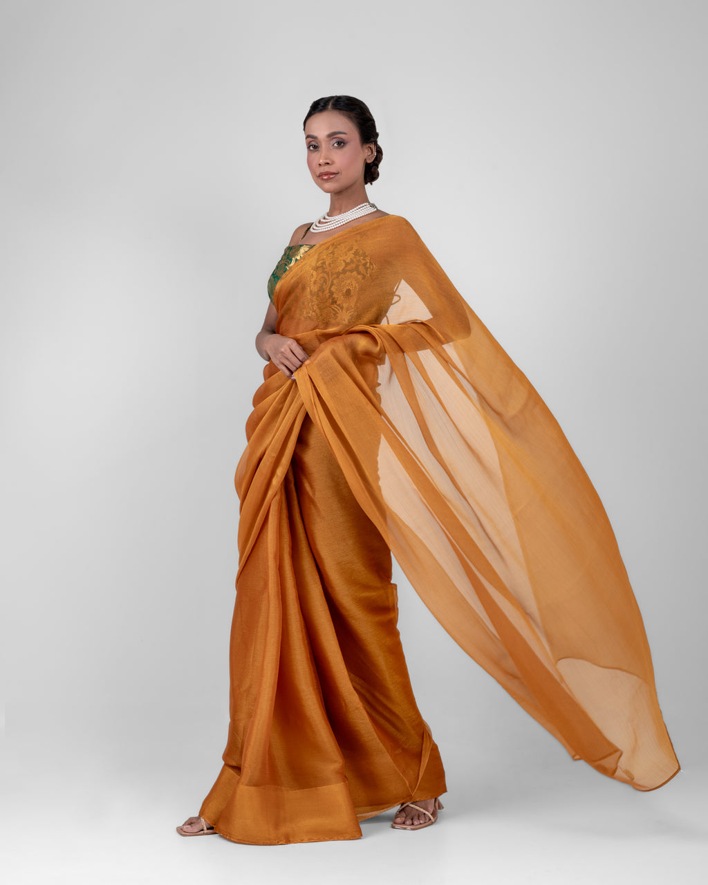 Amber Gold Iconic Chiffon Saree with Handcrafted Mirror Tassels and Matching Blouse Piece