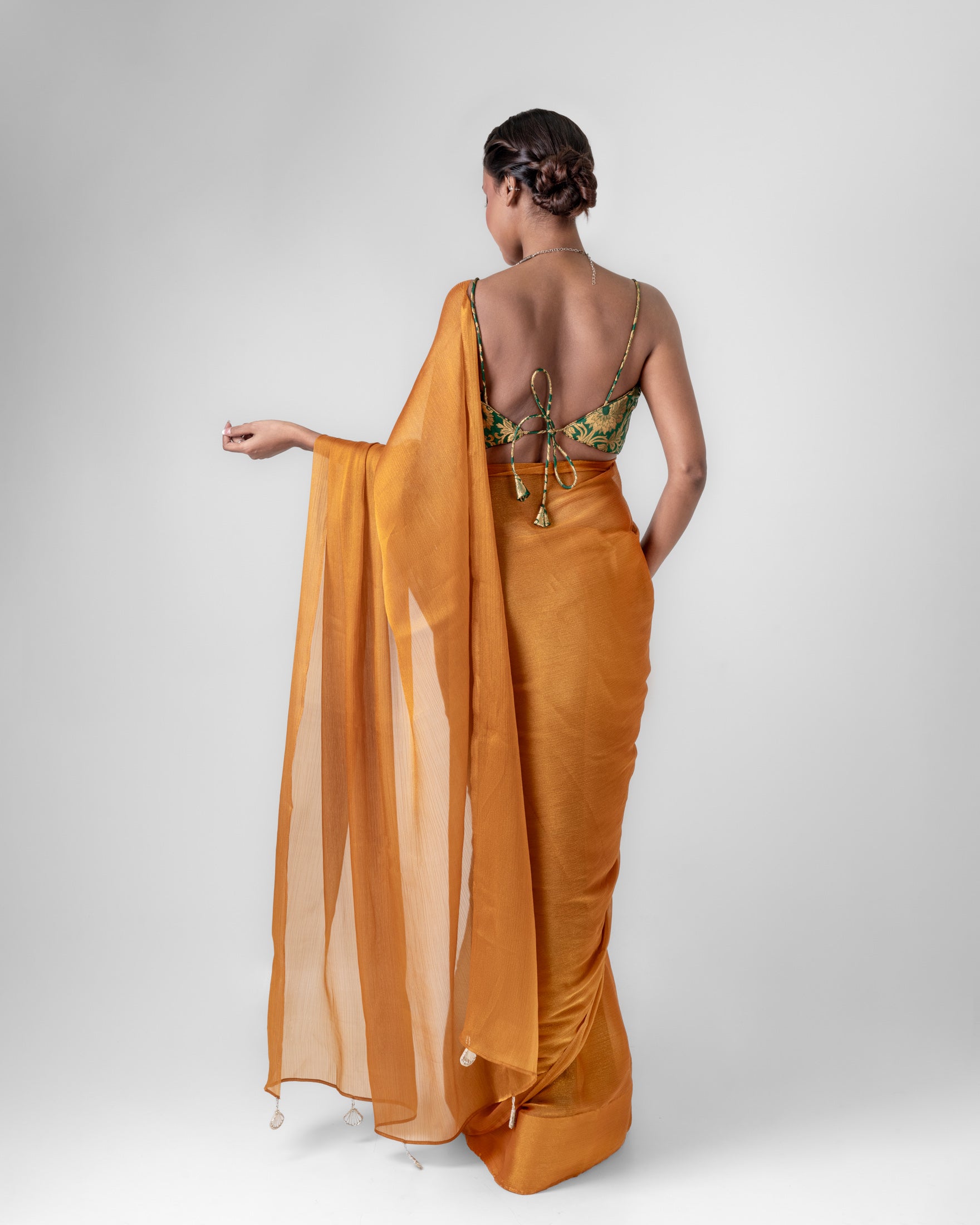 Amber Gold Iconic Chiffon Saree with Handcrafted Mirror Tassels and Matching Blouse Piece