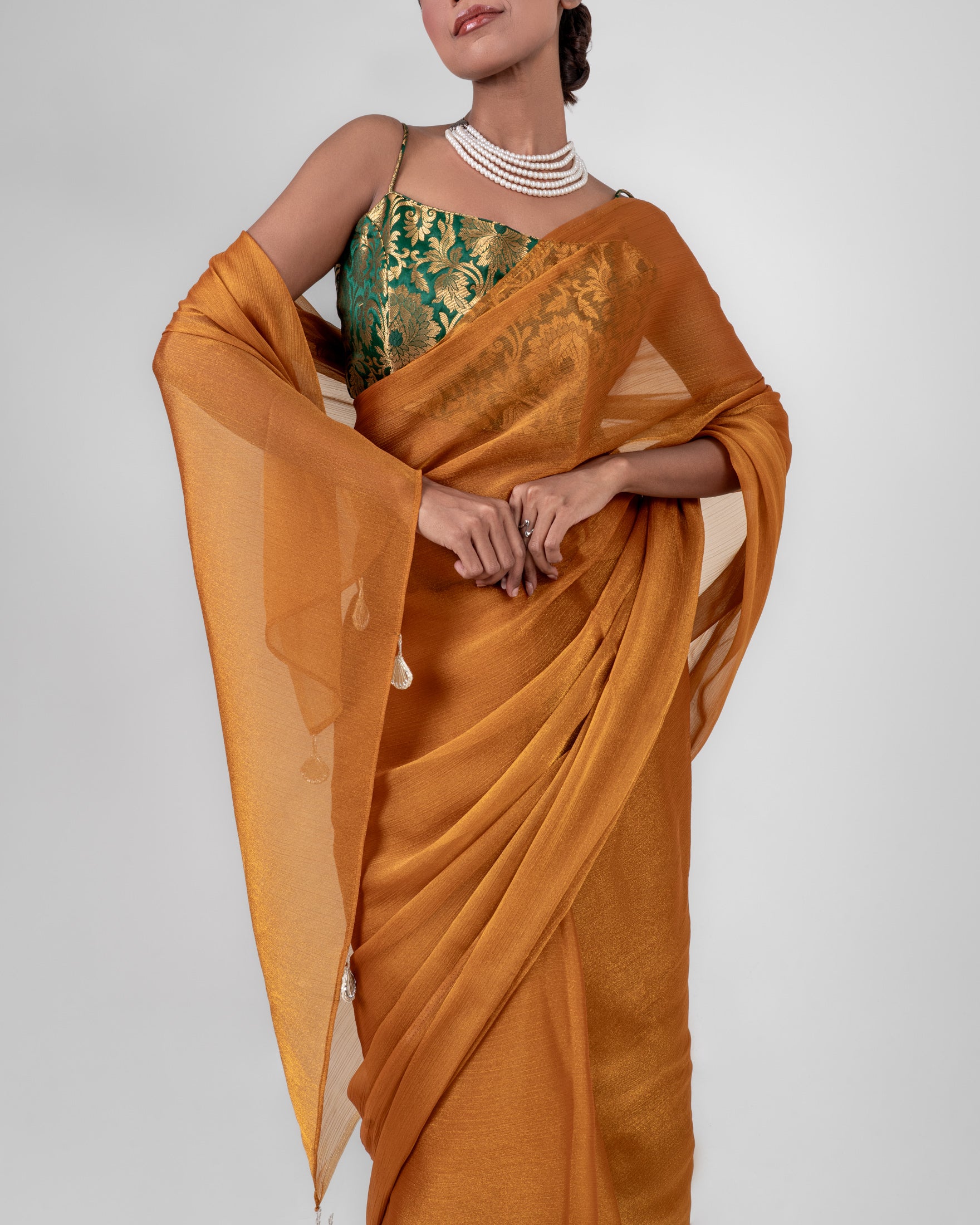 Amber Gold Iconic Chiffon Saree with Handcrafted Mirror Tassels and Matching Blouse Piece